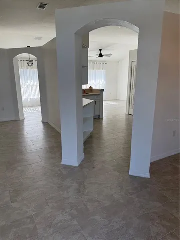 a view of a hallway with seating area