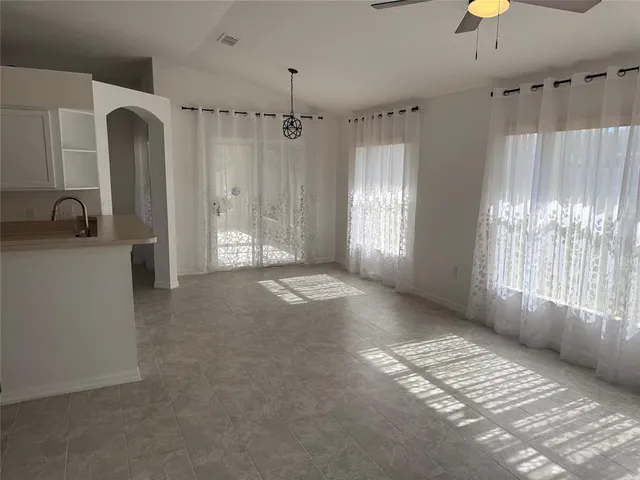 a view of a kitchen with a sink and a window
