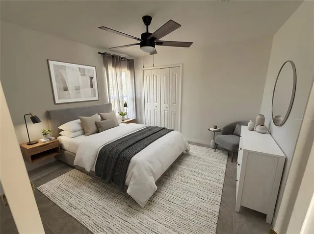 a bedroom with bed and a chandelier