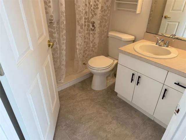 a bathroom with a sink and toilet