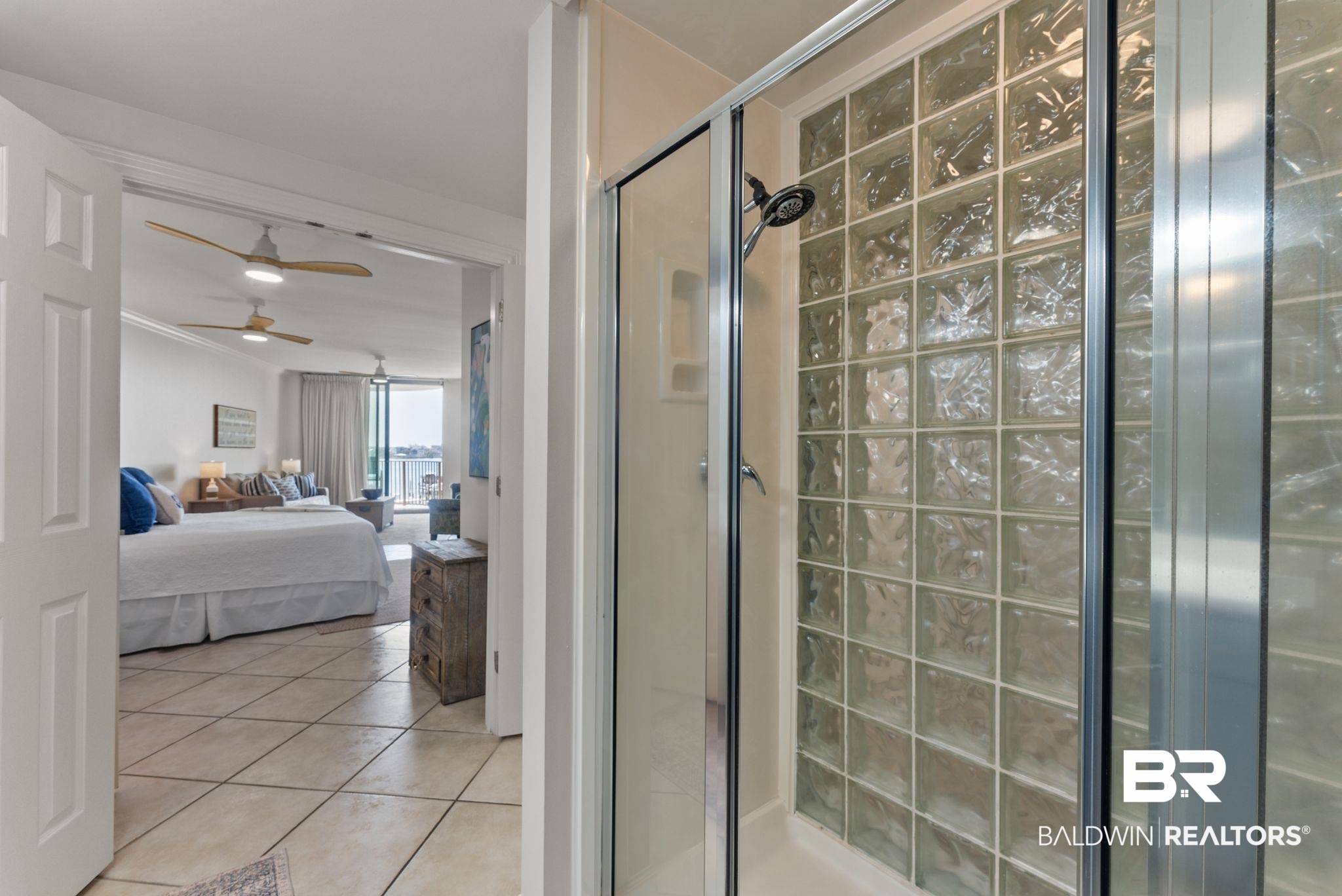 27580 Canal Road, Unit 1233 Orange Beach, AL 36561 - Photo 20 of 79 Full bath with a shower stall, connected bathroom, a ceiling fan, and light tile patterned flooring