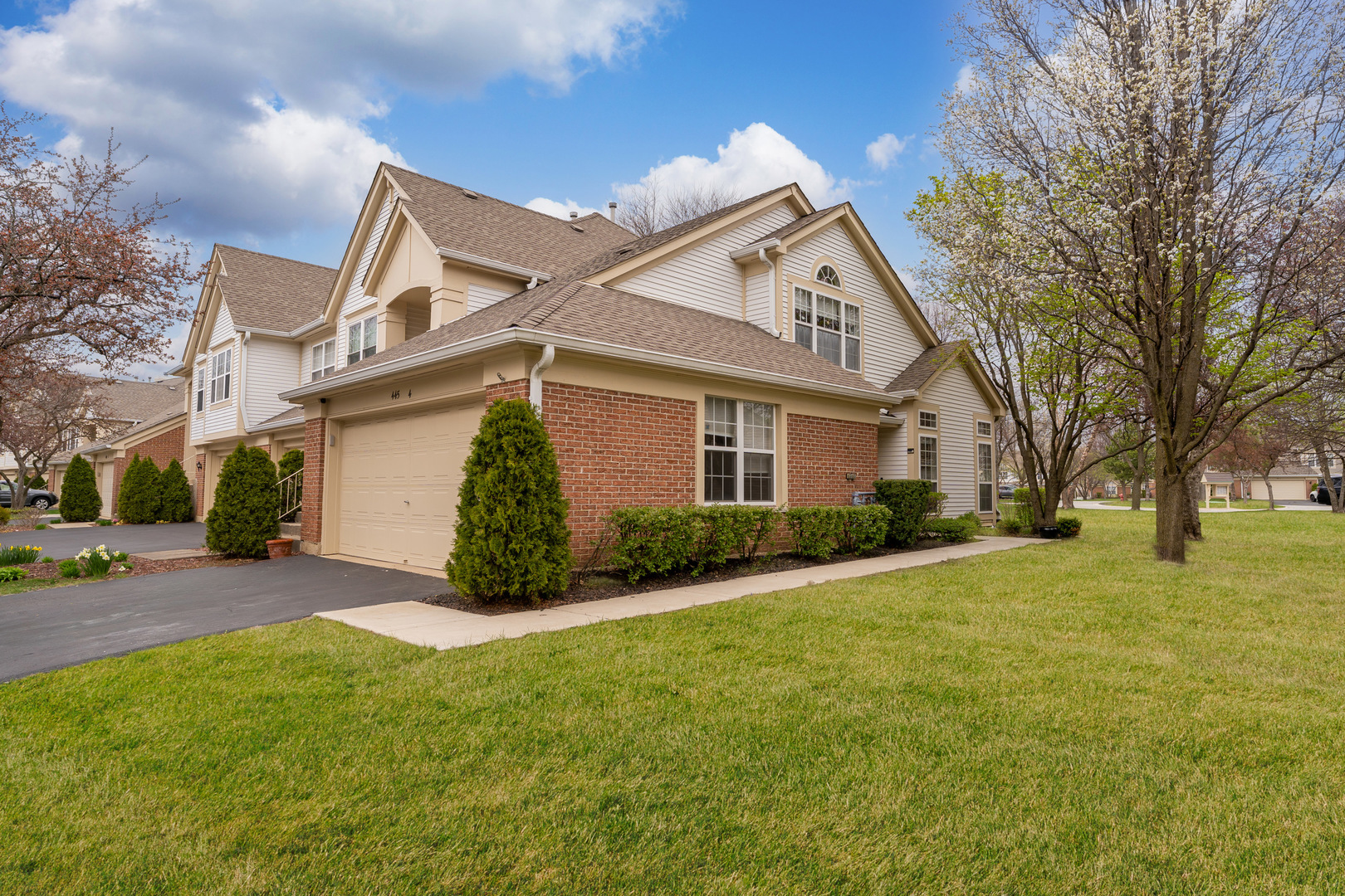 a view of a house and a yard