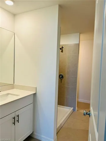 a bathroom with a sink and a shower