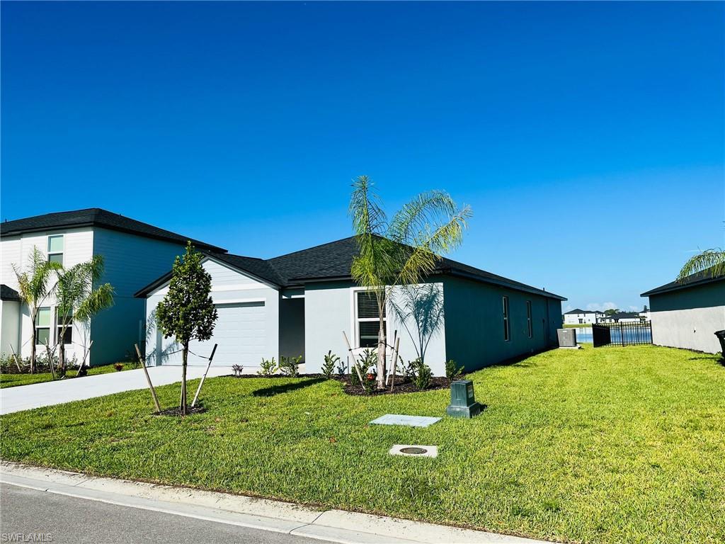 17603 Paradiso Way North Fort Myers, FL 33917 - Photo 25 of 27 a view of a house with a yard