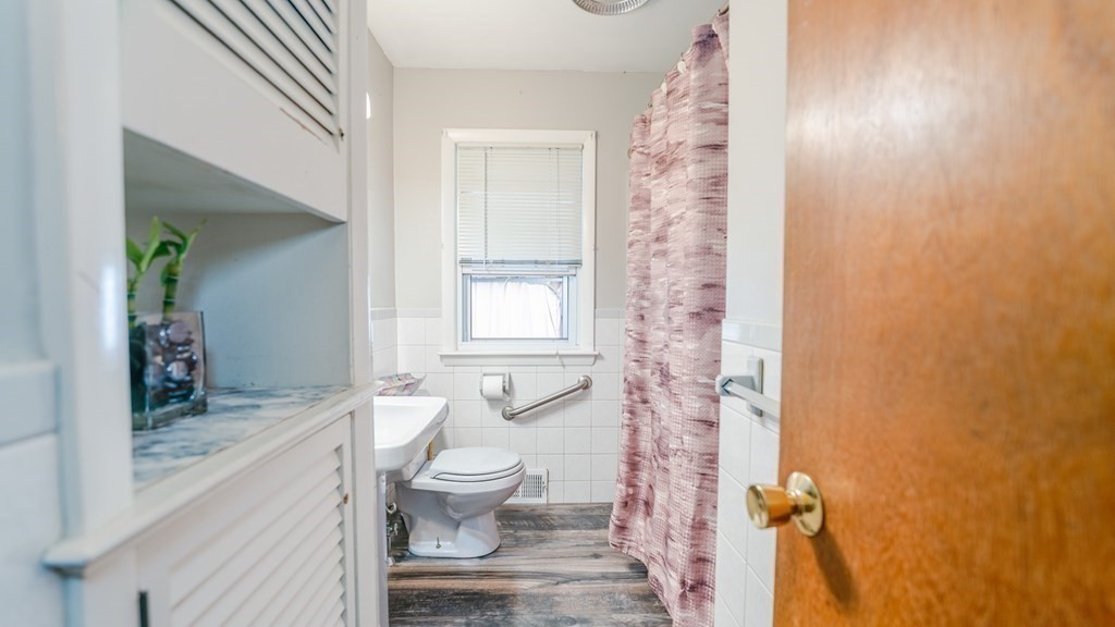 376 Dwight Road Springfield, MA 01108 - Photo 8 of 17 a bathroom with a granite countertop sink a toilet and shower