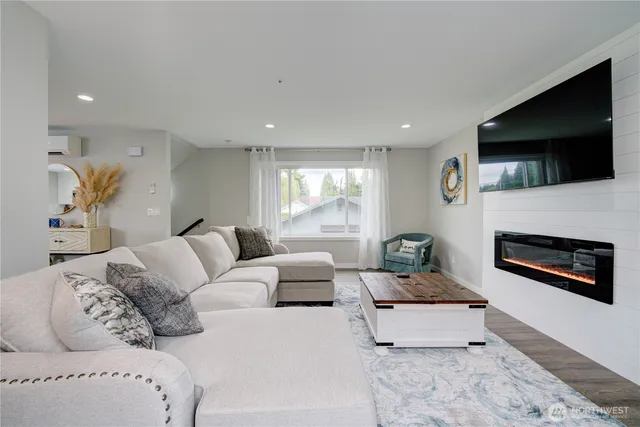 a bathroom with a toilet sink vanity and mirror