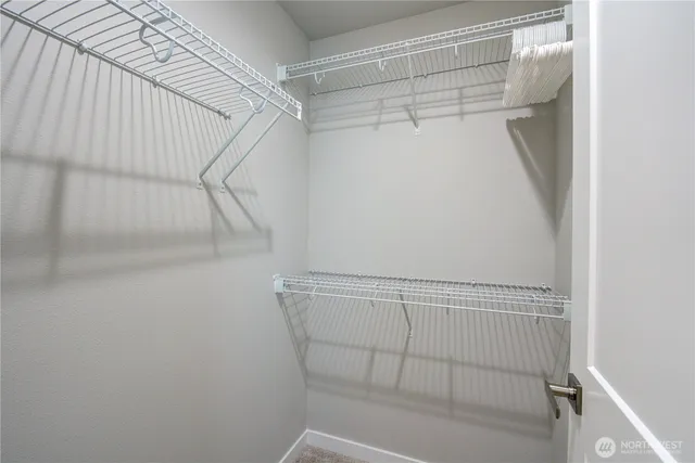 a bathroom with a double vanity sink toilet and shower