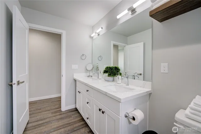 a bedroom with two beds and a window