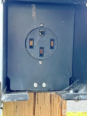 a view of a balcony with a sink and wooden floor