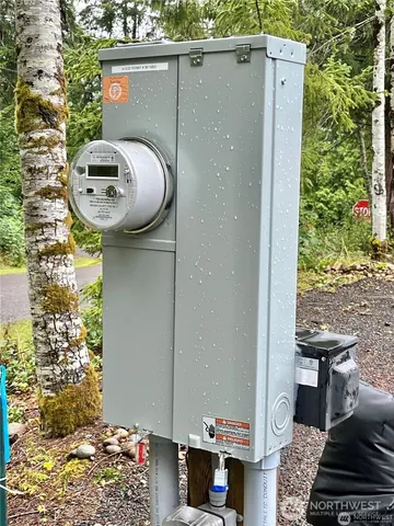 a view of a house with backyard and wooden deck
