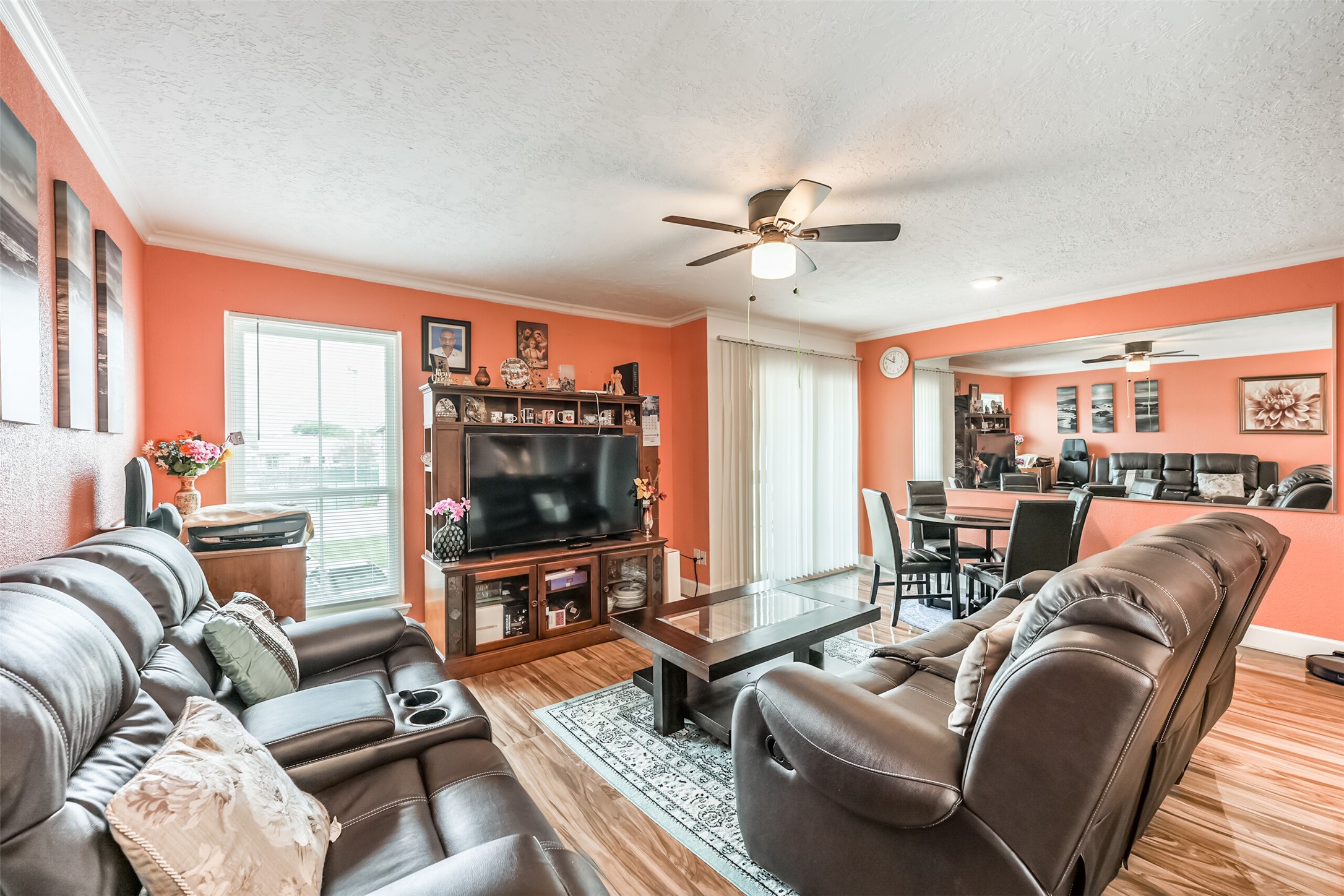 3919 Fairmont Parkway, Unit 184 Pasadena, TX 77504 - Photo 3 of 16 a living room with furniture a flat screen tv and a large window