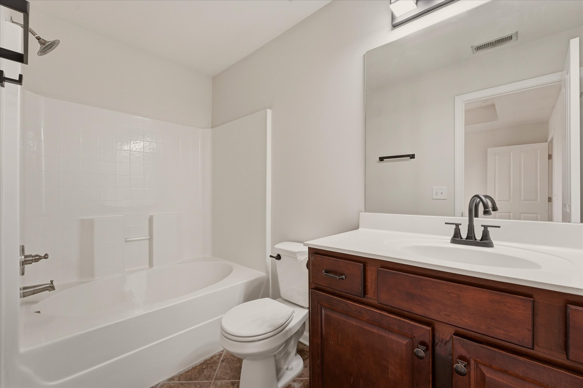 2050 Hemlock Drive Spring Hill, TN 37174 - Photo 18 of 48 a bathroom with a sink a toilet and a bathtub
