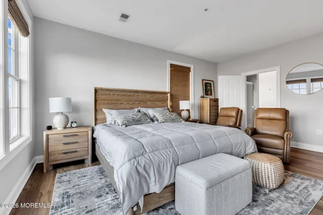 a bedroom with bed and a window