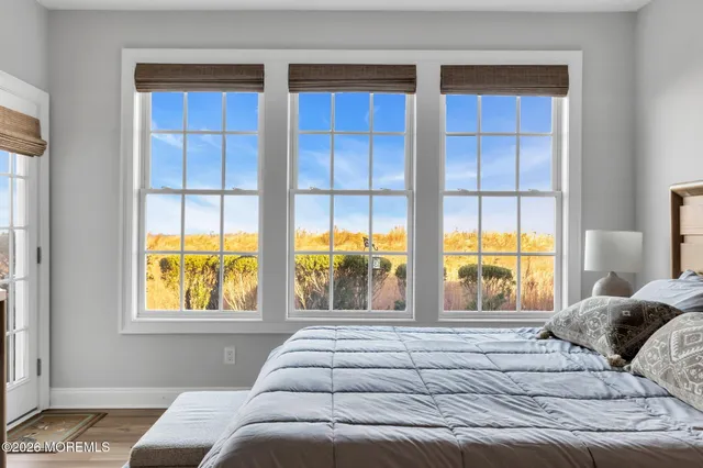 a bedroom with bed and a window