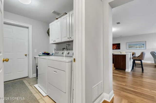 a view of kitchen with cabinets and wooden floor