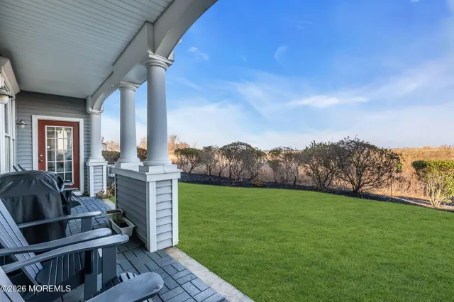 a view of a porch with furniture and mountain view