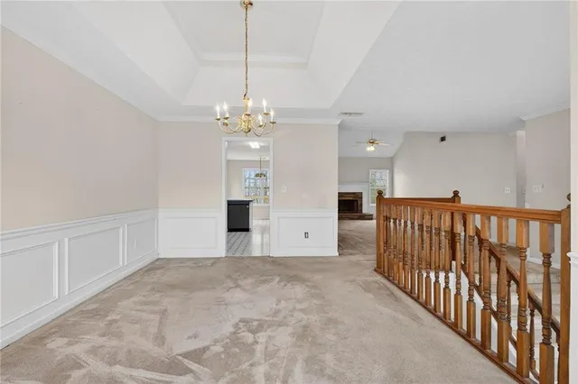 a kitchen with granite countertop a sink a stove and cabinets