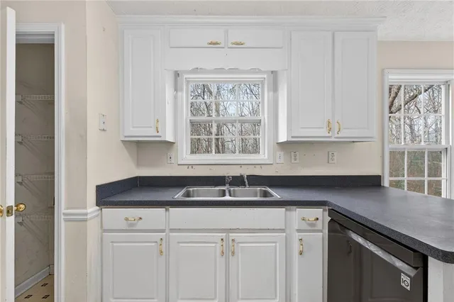 a view of a room with windows and chandelier
