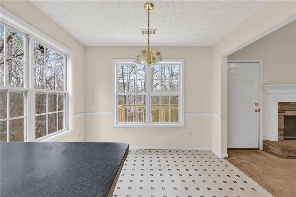 20 Crooked Creek Way Covington, GA 30016 - Photo 22 of 59 a view of a room with windows and chandelier