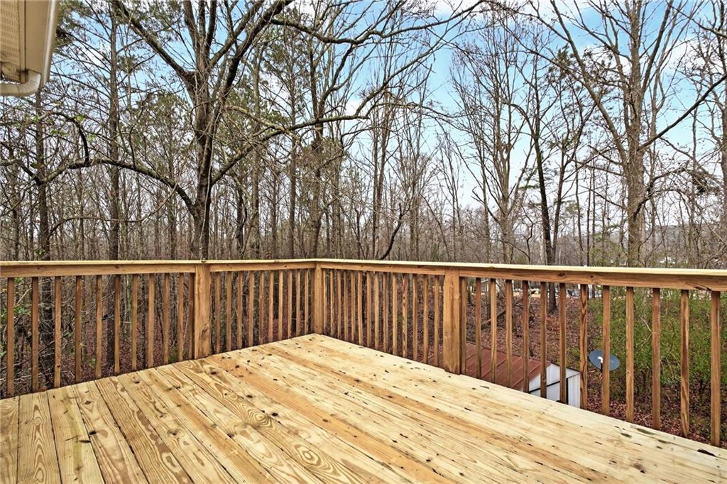 20 Crooked Creek Way Covington, GA 30016 - Photo 24 of 59 a view of balcony with wooden floor and fence