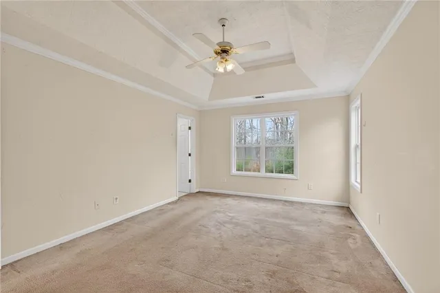 a bathroom with a granite countertop tub a sink and a window