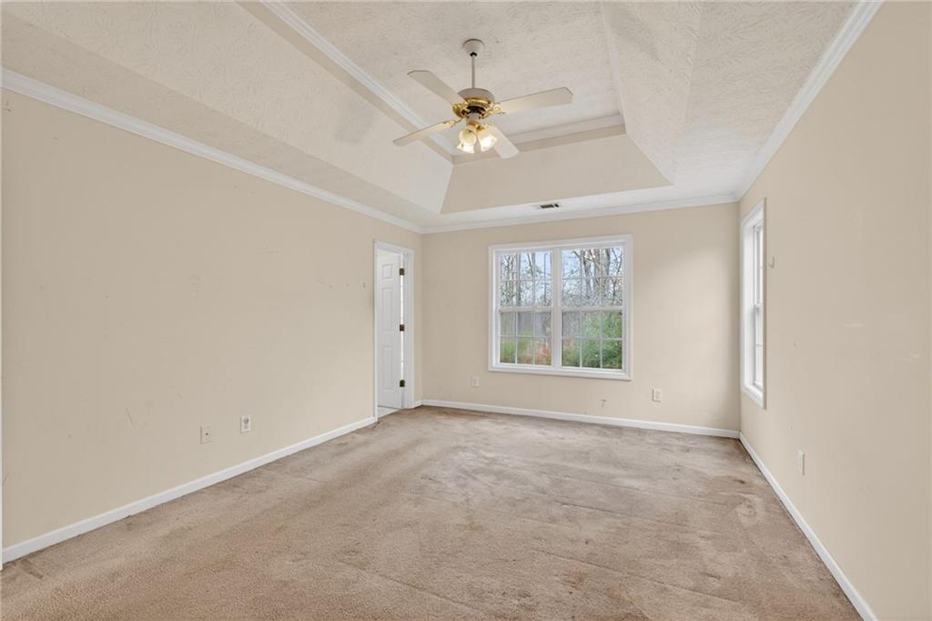 20 Crooked Creek Way Covington, GA 30016 - Photo 28 of 59 an empty room with a ceiling fan and window