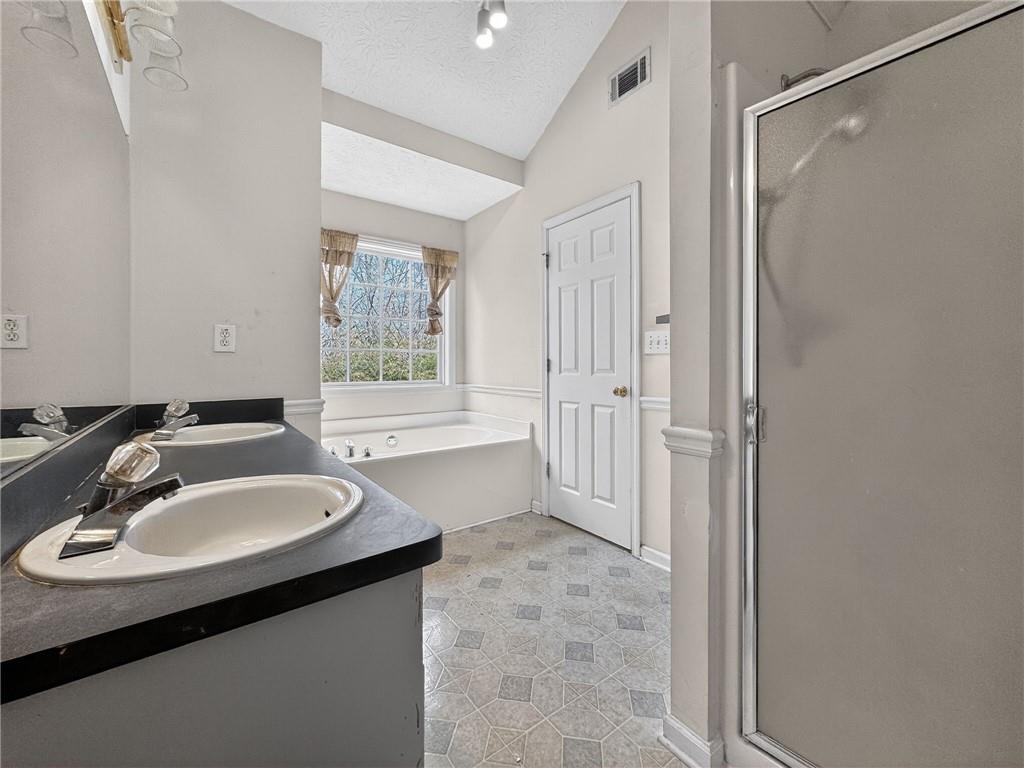 20 Crooked Creek Way Covington, GA 30016 - Photo 33 of 59 a bathroom with a sink and a mirror