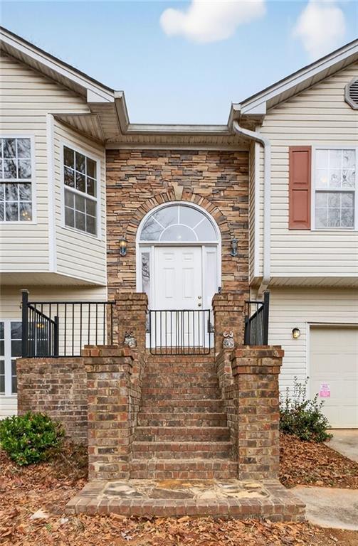 20 Crooked Creek Way Covington, GA 30016 - Photo 4 of 59 a front view of a house with a porch
