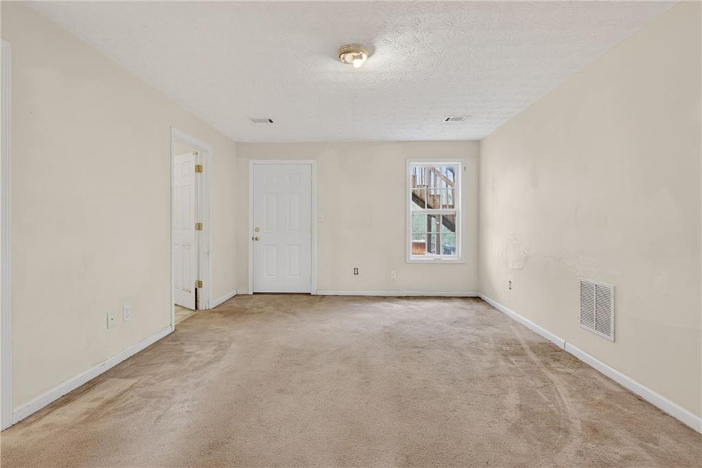 20 Crooked Creek Way Covington, GA 30016 - Photo 42 of 59 an empty room with windows