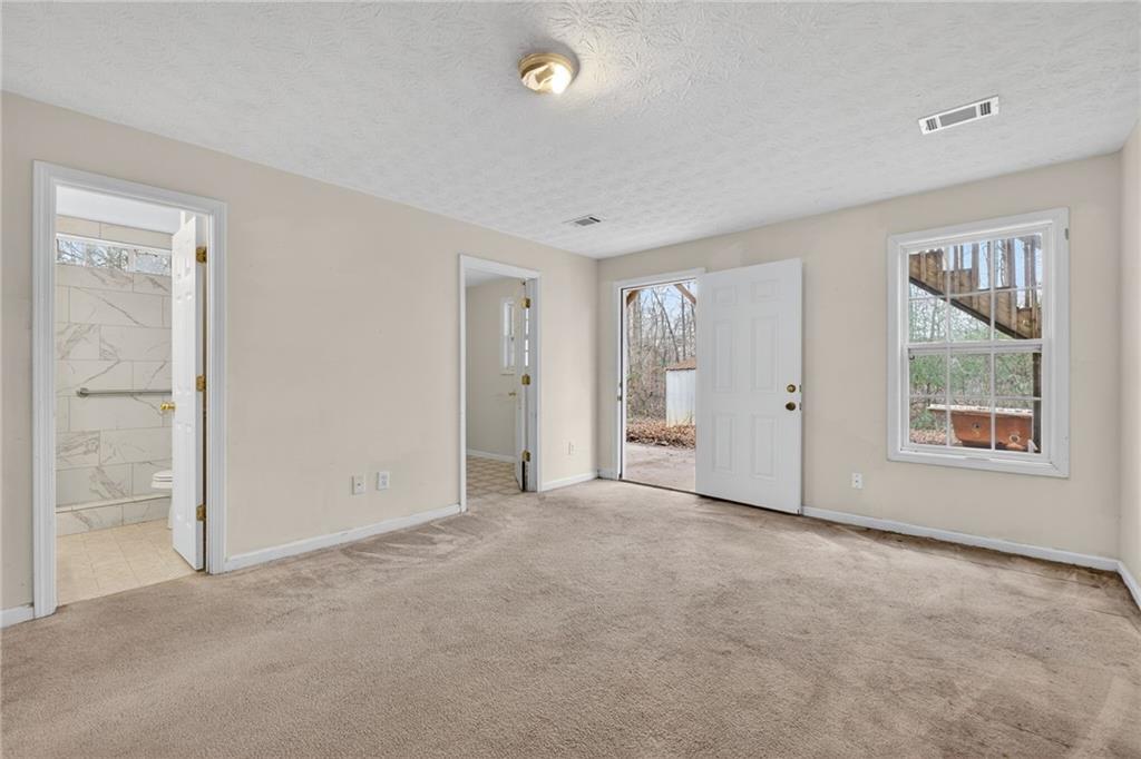 20 Crooked Creek Way Covington, GA 30016 - Photo 43 of 59 an empty room with windows and closet