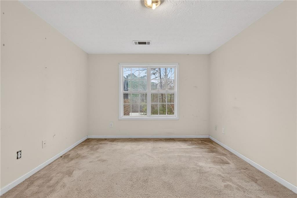20 Crooked Creek Way Covington, GA 30016 - Photo 46 of 59 an empty room with a window