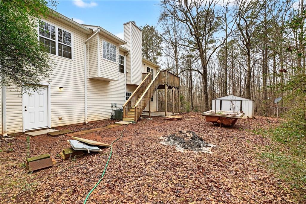 20 Crooked Creek Way Covington, GA 30016 - Photo 50 of 59 a backyard of a house with a yard and outdoor seating