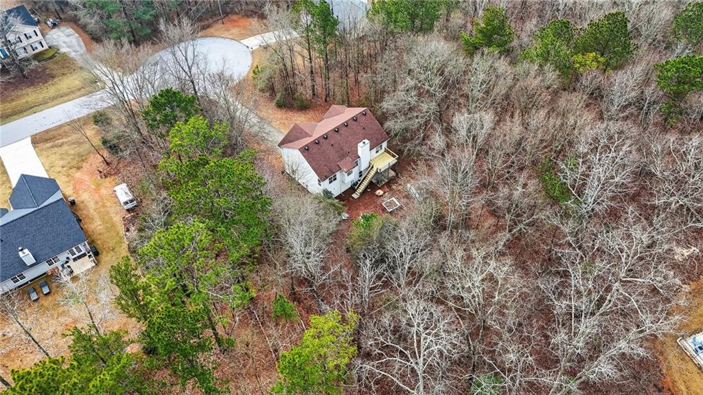 20 Crooked Creek Way Covington, GA 30016 - Photo 58 of 59 an aerial view of a house with a yard and trees all around