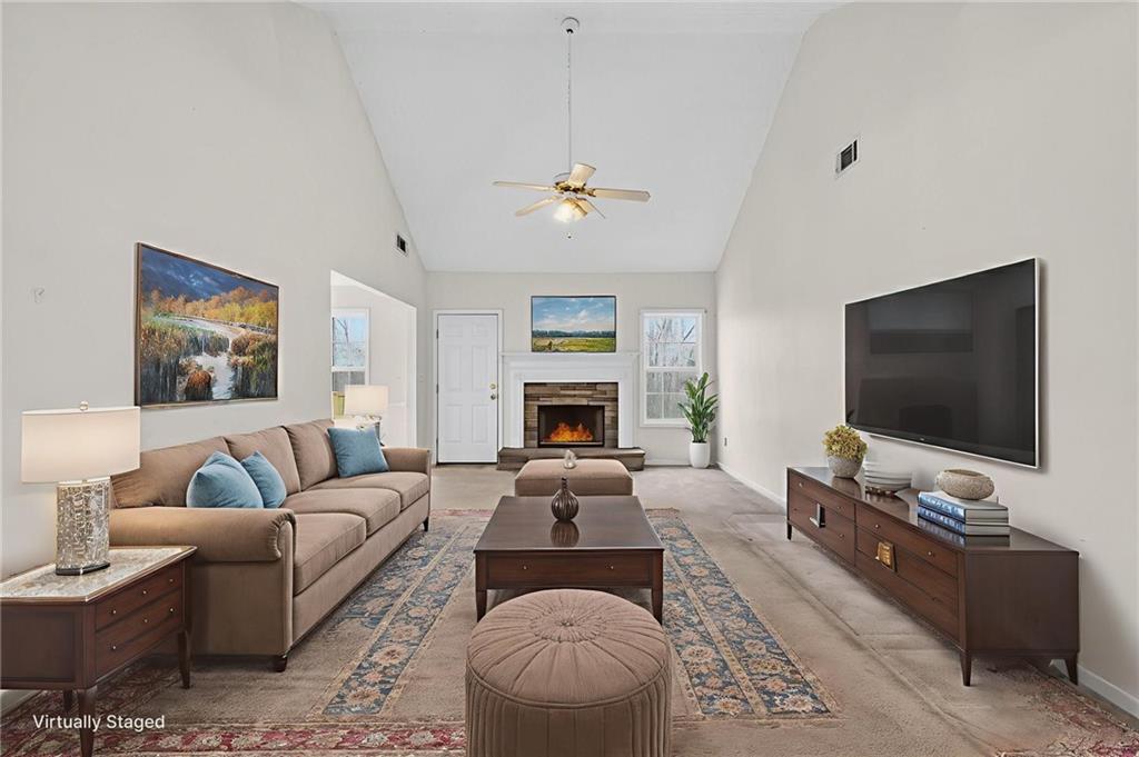 20 Crooked Creek Way Covington, GA 30016 - Photo 7 of 59 a living room with furniture fireplace and flat screen tv