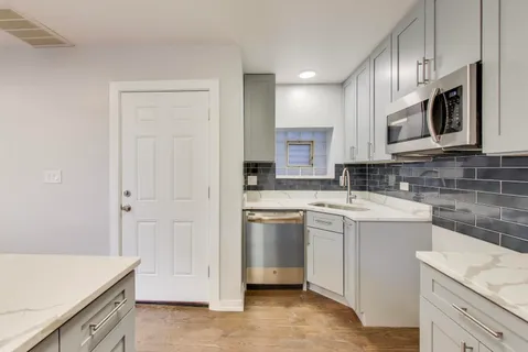 a bathroom with a bathtub and shower