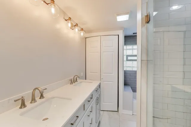 a bathroom with a toilet a sink and bath tub