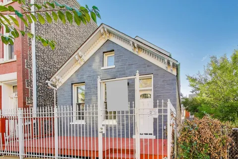 a view of a house with a small yard