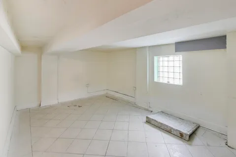 a view of a balcony with wooden floor