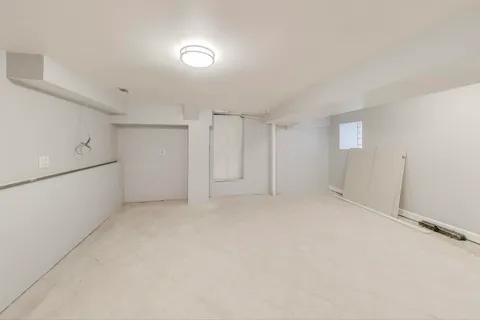 a view of a living room and kitchen with furniture wooden floor and windows