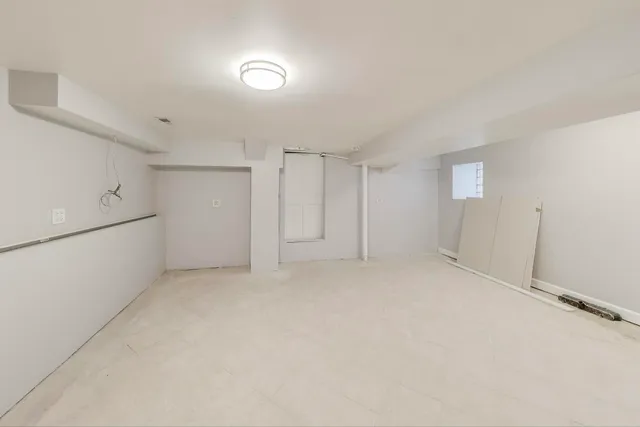 a view of a living room and kitchen with furniture wooden floor and windows