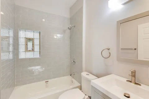 a view of a kitchen with a sink and a stove top oven