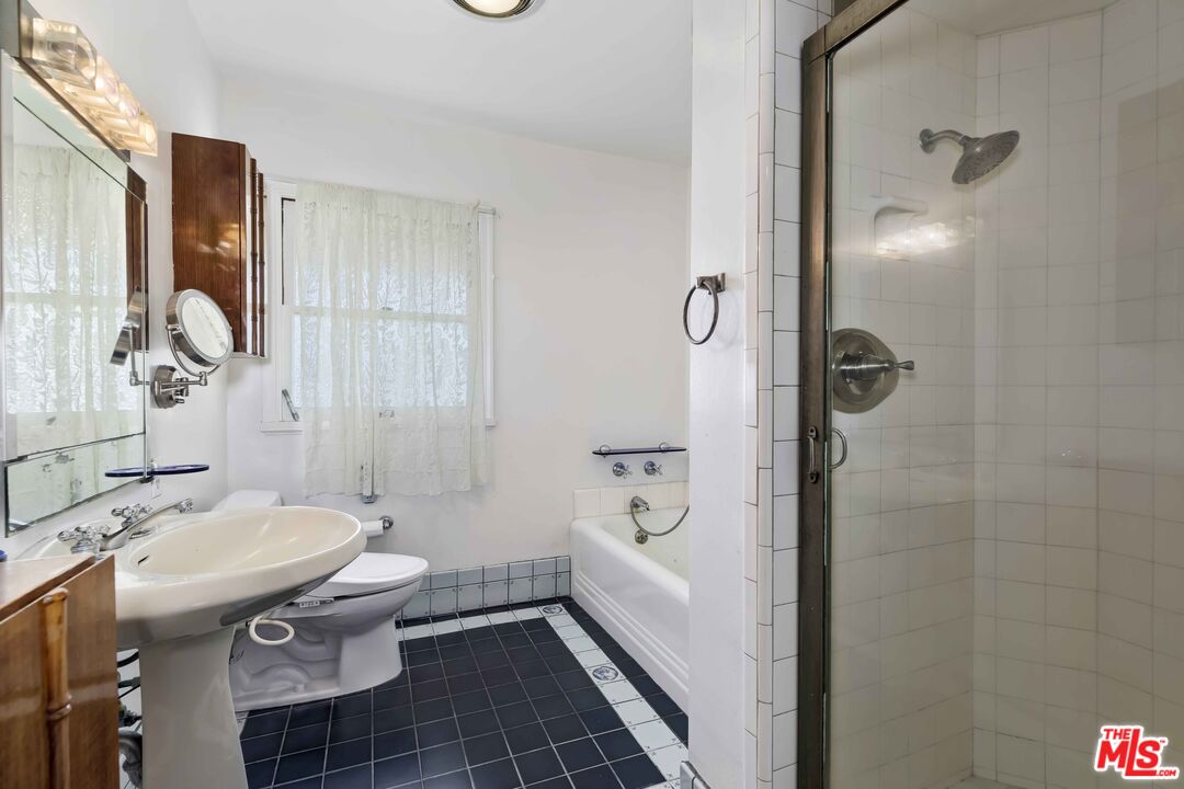 363 West Channel Road Santa Monica, CA 90402 - Photo 15 of 21 a bathroom with a sink toilet and shower