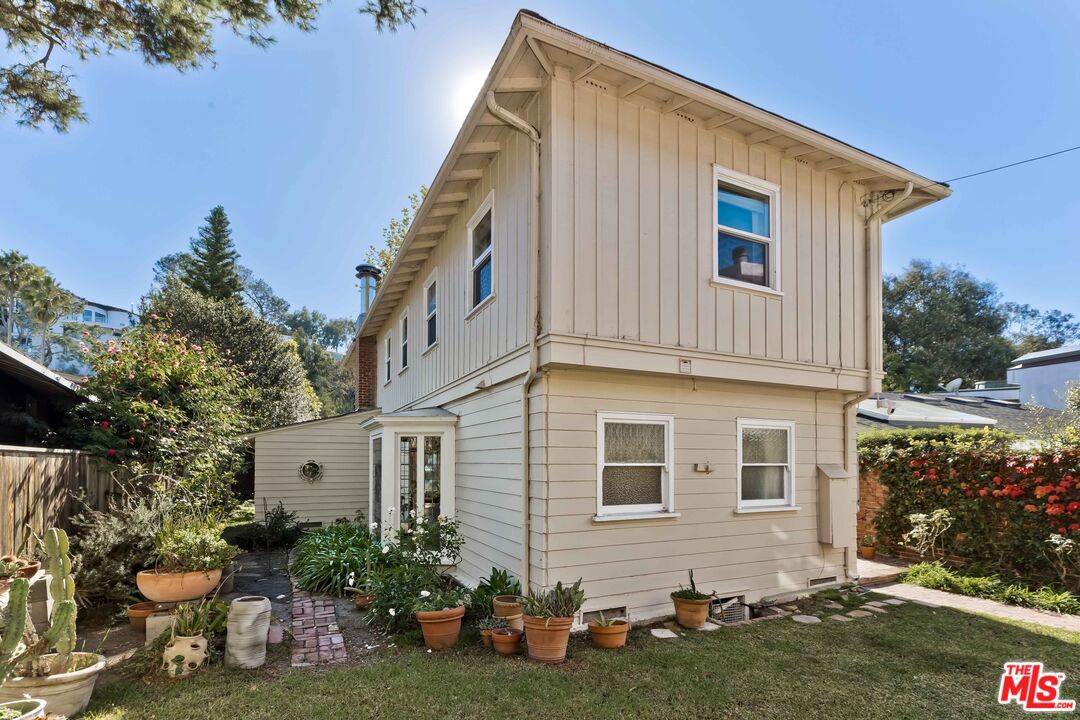 363 West Channel Road Santa Monica, CA 90402 - Photo 16 of 21 a view of a house with a yard