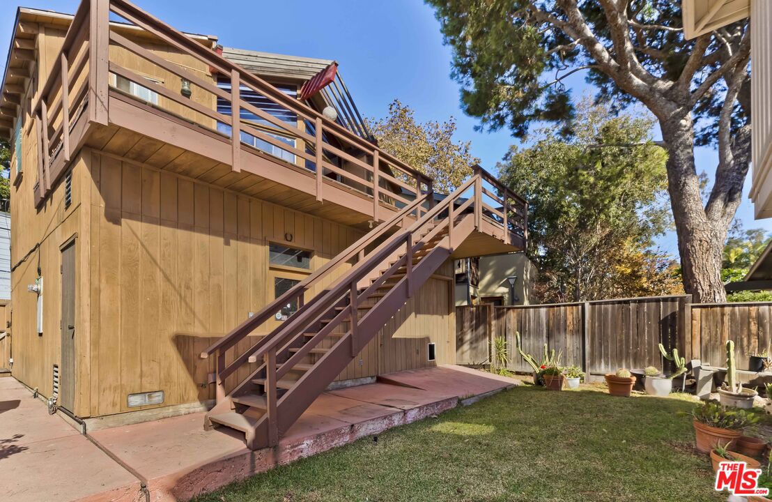 363 West Channel Road Santa Monica, CA 90402 - Photo 17 of 21 a view of a house with a yard
