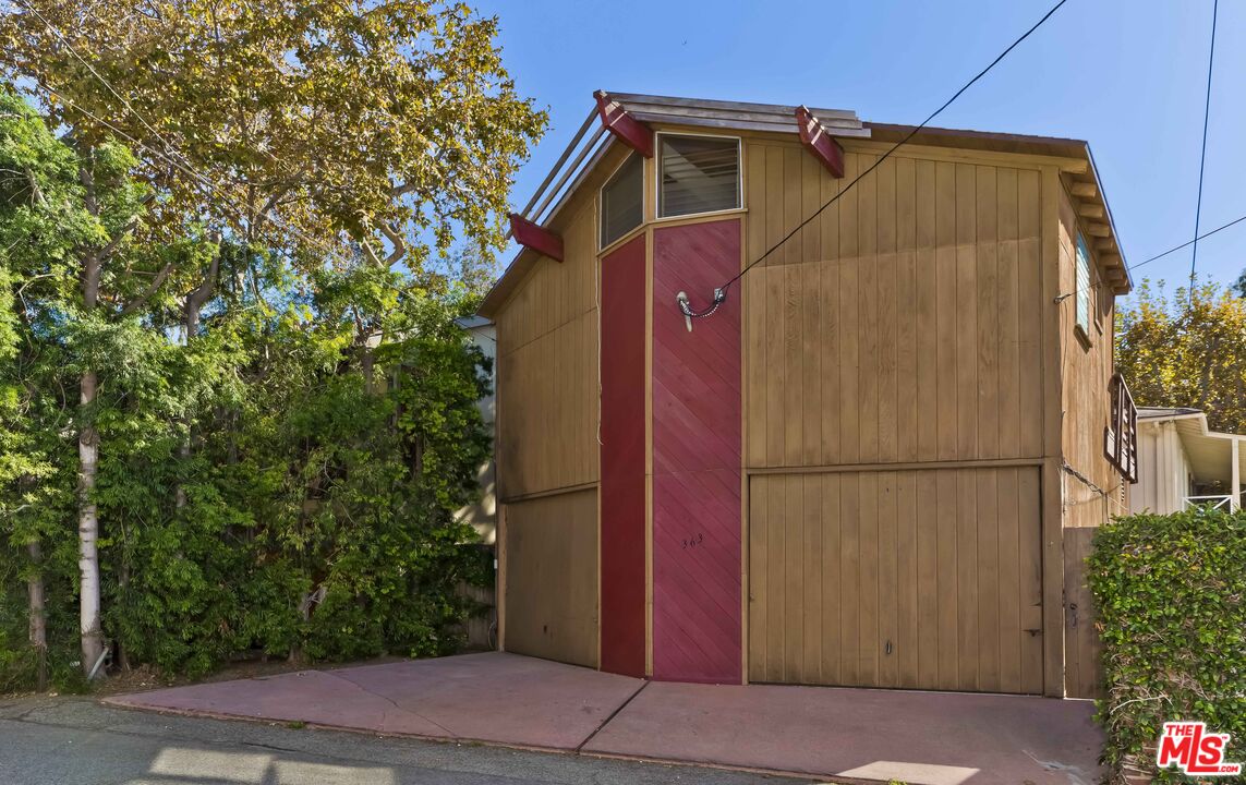 363 West Channel Road Santa Monica, CA 90402 - Photo 18 of 21 a white house with tree in the background