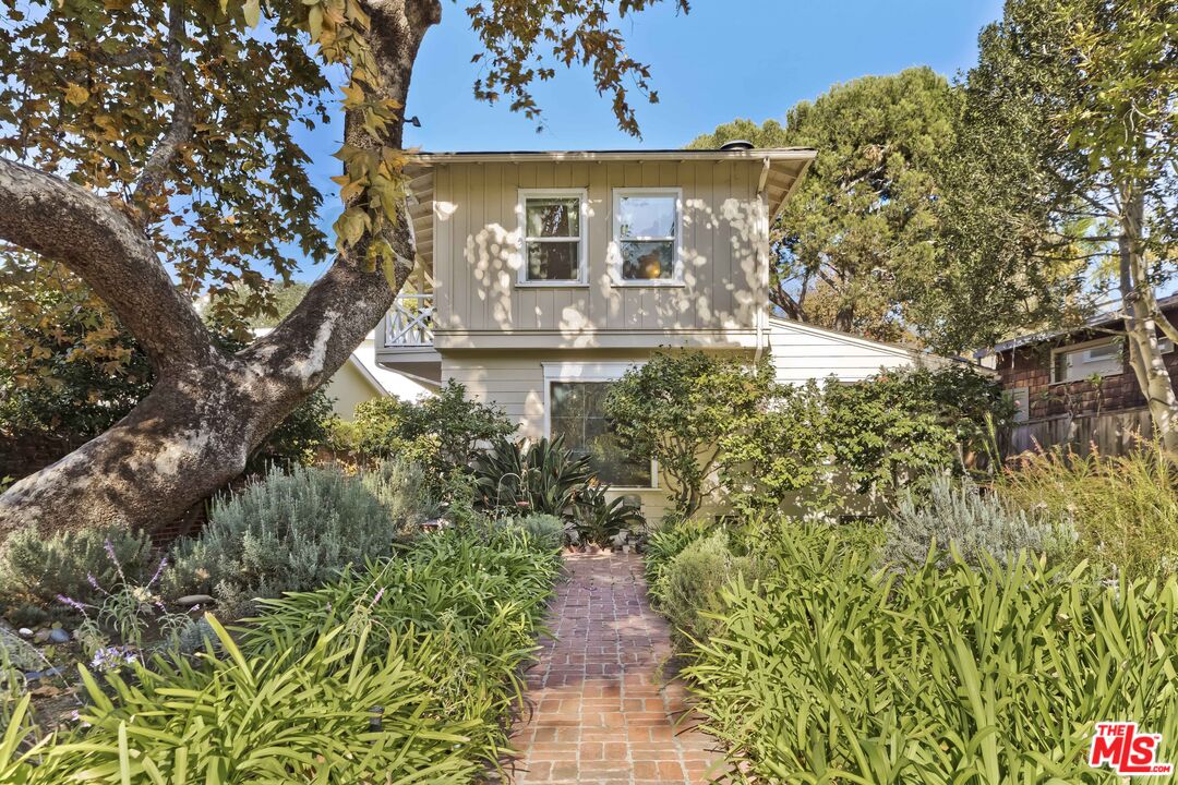 363 West Channel Road Santa Monica, CA 90402 - Photo 2 of 21 a view of a house with a yard