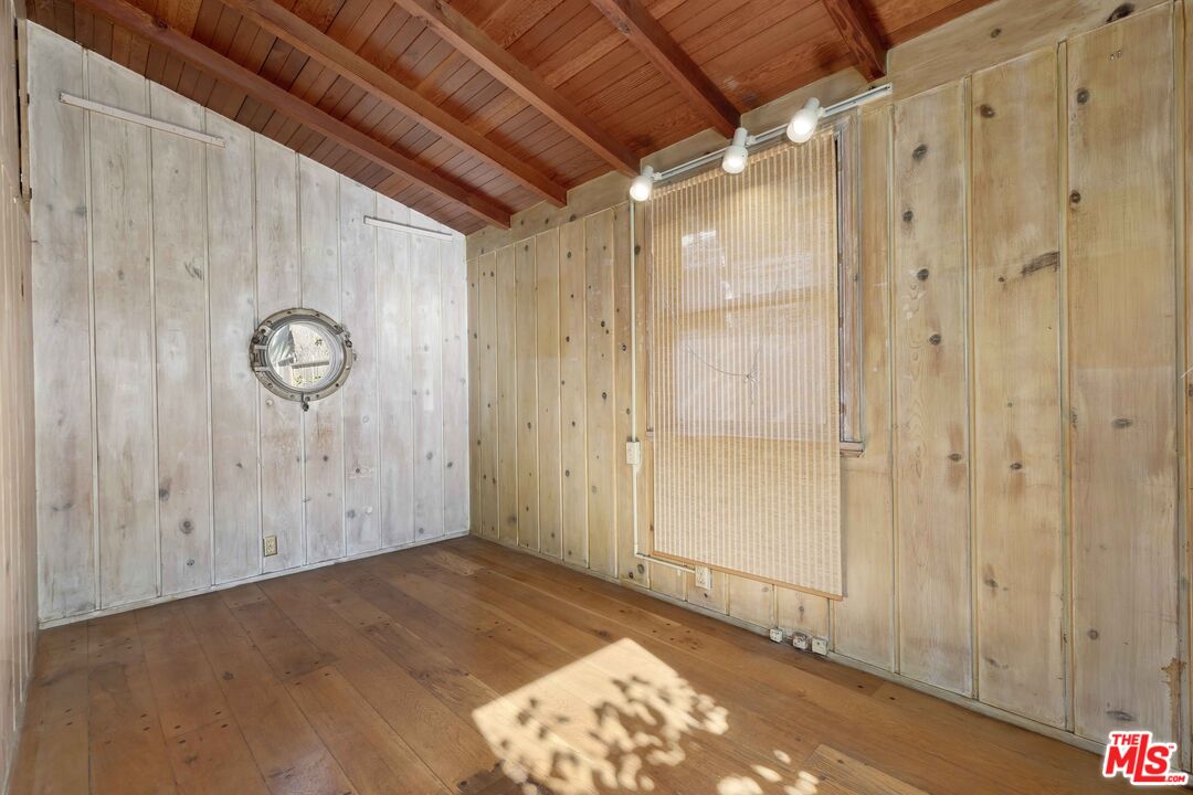 363 West Channel Road Santa Monica, CA 90402 - Photo 6 of 21 a view of an empty room with wooden floor