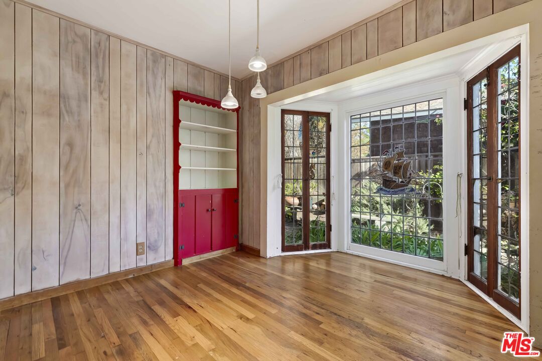 363 West Channel Road Santa Monica, CA 90402 - Photo 8 of 21 wooden floor in an empty room with a window