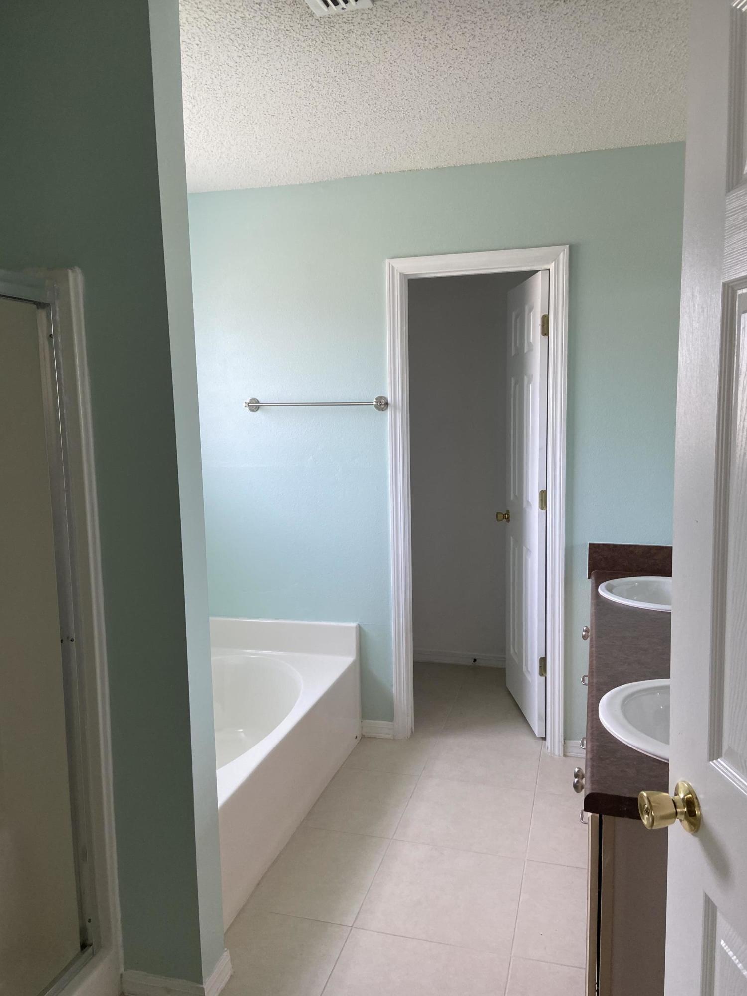 239 Limestone Circle Crestview, FL 32539 - Photo 13 of 15 a bathroom with a tub and shower