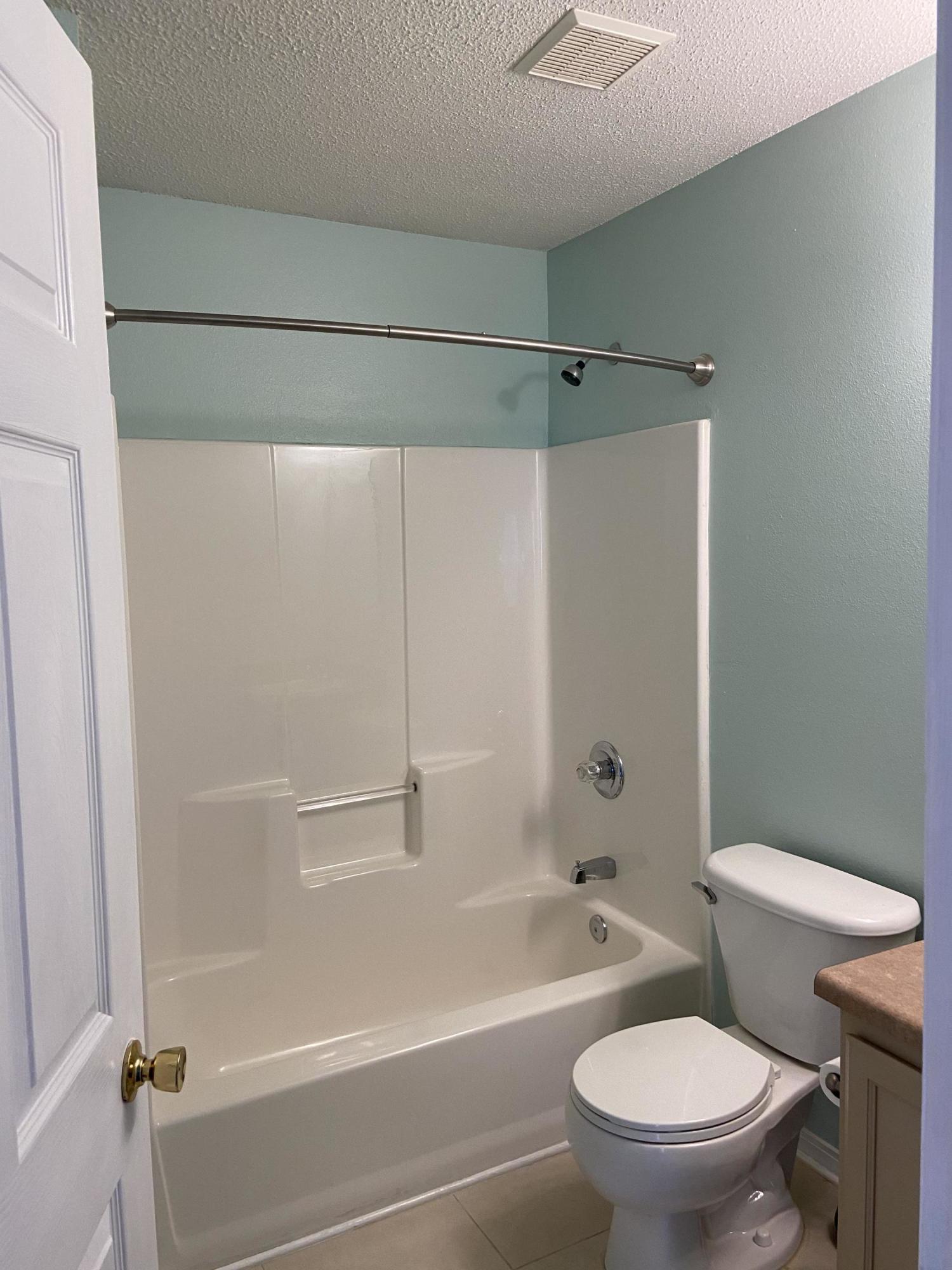 239 Limestone Circle Crestview, FL 32539 - Photo 6 of 15 a bathroom with a toilet and a shower